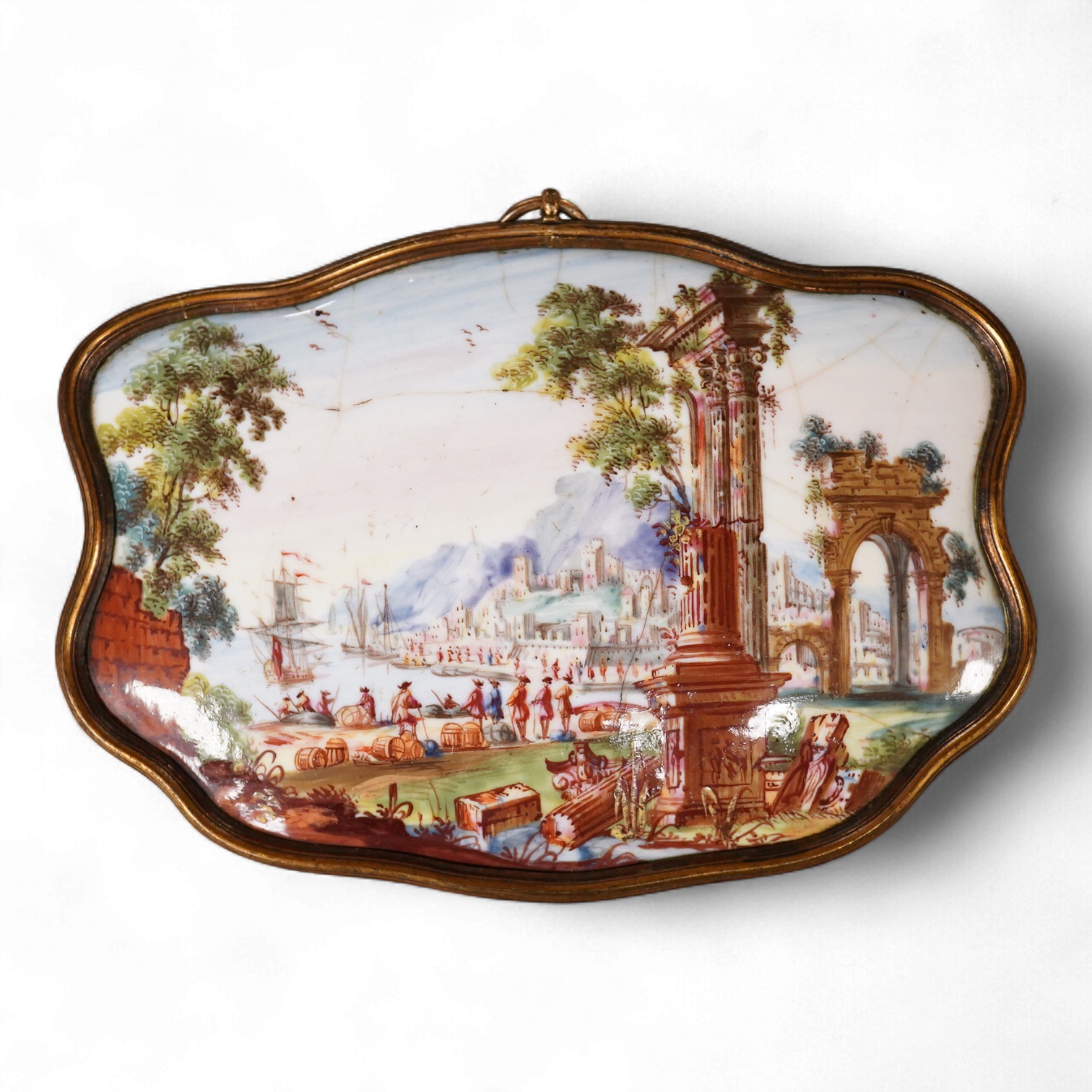 A late 18th century enamel panel painted with a continental landscape, 11.5cm wide